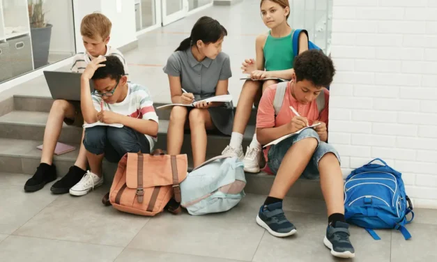 To what extent does having a sense of connectedness and belonging in school influence the ways in which young people cope with past trauma?